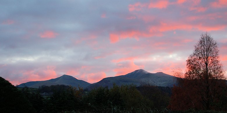 Clouds over the Brecon Beacons tinged with red from the setting sun: 23rd November 2013